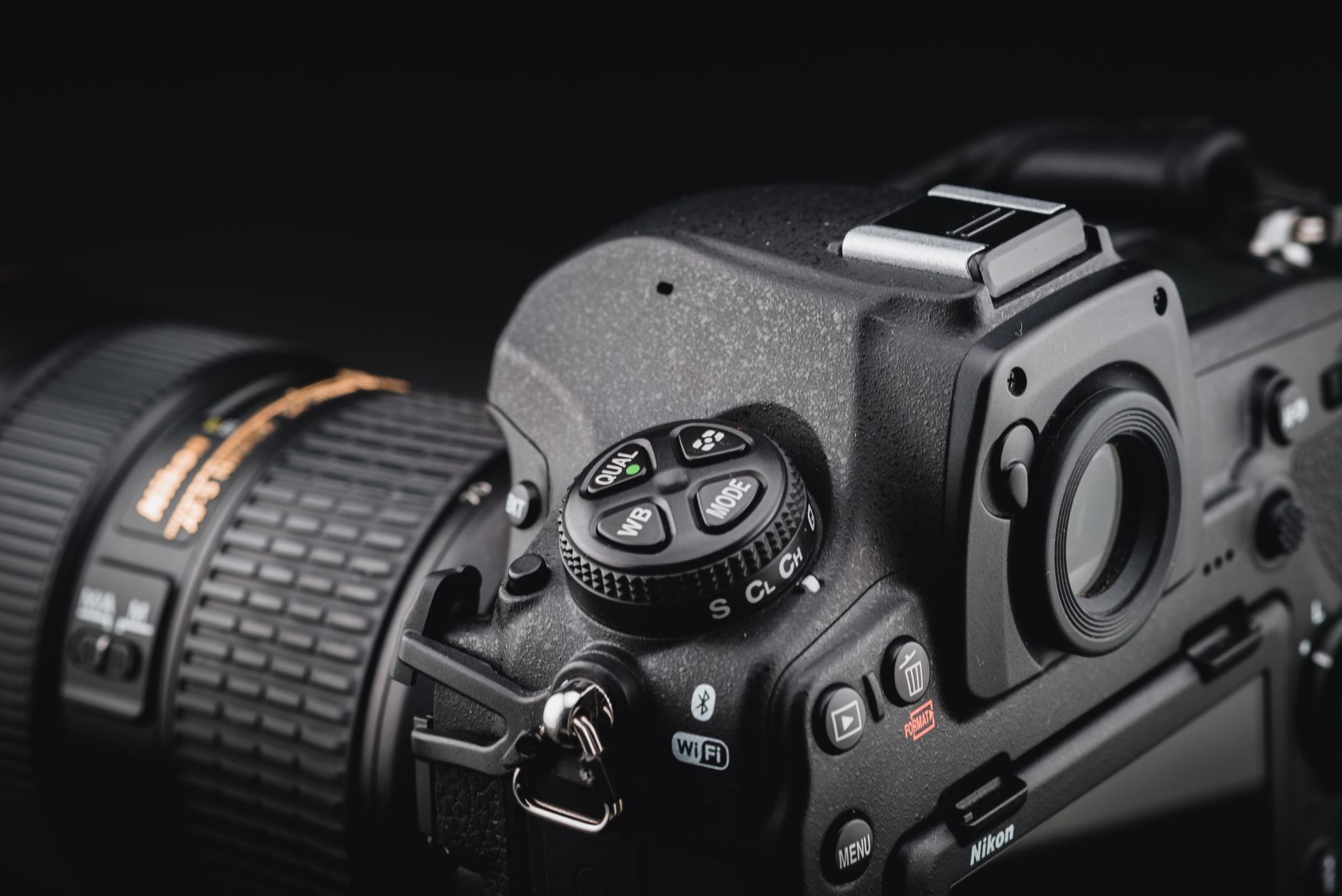Step 2: Match project resolution and frame rate: Detailed close-up of a DSLR camera, highlighting its controls.