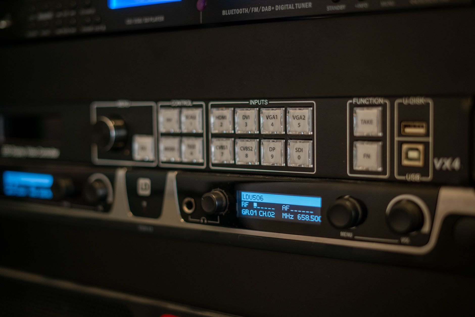 Step 4: Set video bitrate for target quality: Detailed view of audio equipment showing inputs and digital controls in a studio setting.